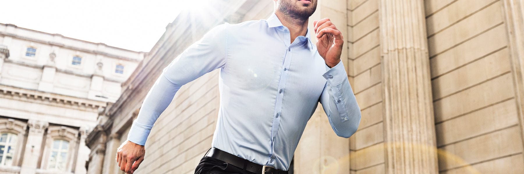 Muscle-fit shirt paired with jeans and shorts offering a modern and tailored appearance