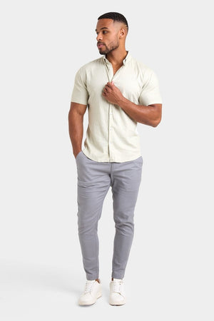Linen Blend Cropped Pleated Trousers in Mole - TAILORED ATHLETE - ROW