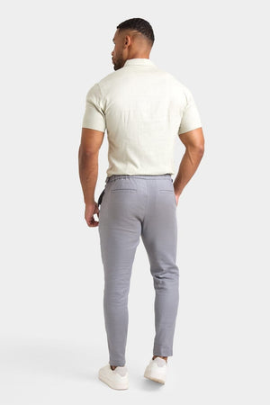 Linen Blend Cropped Pleated Trousers in Mole - TAILORED ATHLETE - ROW