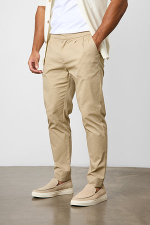 Smart Pleated Cotton Side Adjust Trouser in Stone - TAILORED ATHLETE - ROW