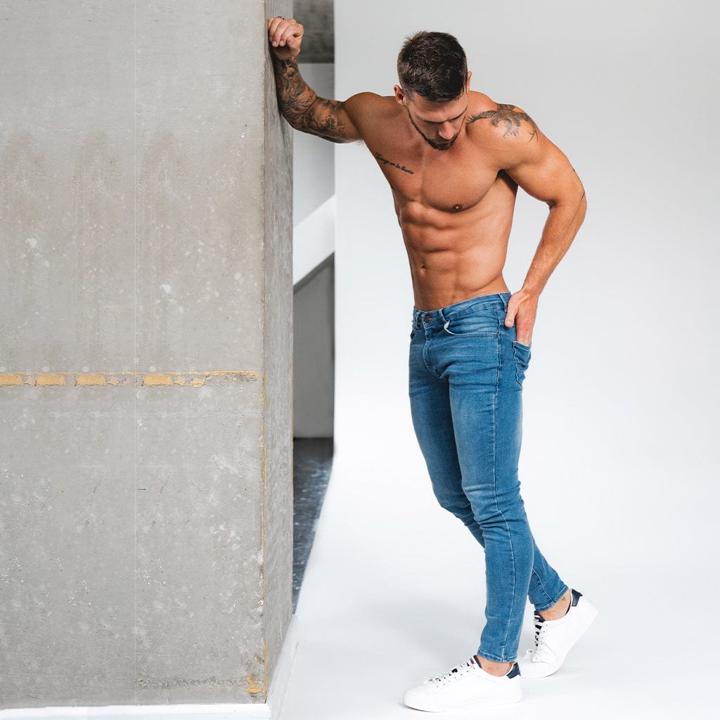 Stylish muscle fit jeans offering comfort and perfect fit for athletic builds in a variety of colors