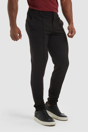 Stitched Crease Trousers in Black - TAILORED ATHLETE - ROW