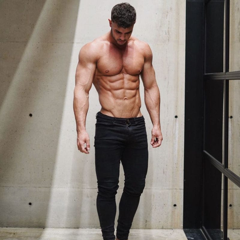 Stylish muscle-fit denim jeans providing a comfortable and flattering fit for muscular physiques