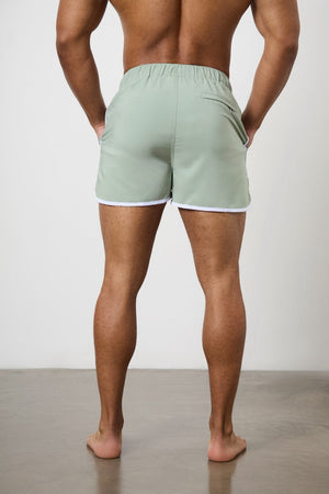 Piped Swim Short in Soft Sage - TAILORED ATHLETE - ROW