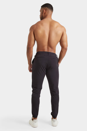 Everyday Tech Trousers in Black - TAILORED ATHLETE - ROW