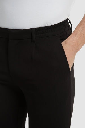 Cropped Pleated Trousers in Black - TAILORED ATHLETE - ROW